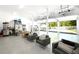 Spacious four-car garage featuring epoxy flooring, ample storage, and seating area at 8175 Main St, Woodstock, GA 30188
