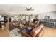 Inviting open-concept living room connected to the kitchen and dining areas at 8175 Main St, Woodstock, GA 30188