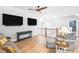 Spacious loft featuring hardwood floors, two flat screen TVs, and comfortable seating at 8175 Main St, Woodstock, GA 30188