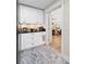 Pantry with modern black hardware and marble floors at 8175 Main St, Woodstock, GA 30188