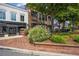 View of local businesses featuring well-maintained sidewalks and landscaping, creating a welcoming atmosphere at 8175 Main St, Woodstock, GA 30188