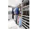 Well-organized walk-in closet with shelving and hanging space for clothing, shoes, and accessories at 8175 Main St, Woodstock, GA 30188