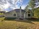The back of the house features large windows, a patio and a fire pit at 9454 Lakeview Ct, Douglasville, GA 30135