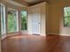 Cozy bedroom with wood floors, neutral walls, and natural light at 9454 Lakeview Ct, Douglasville, GA 30135