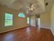 Large bedroom featuring vaulted ceilings, wood floors, and three windows providing lots of natural light at 9454 Lakeview Ct, Douglasville, GA 30135