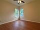Bright bedroom with hardwood floors, two windows, and ceiling fan, creating a comfortable retreat at 9454 Lakeview Ct, Douglasville, GA 30135