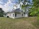 Side view of the home showing an air conditioning unit in the yard at 9454 Lakeview Ct, Douglasville, GA 30135