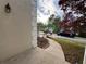 Side view of stucco house with beautiful landscaping and sidewalk at 9454 Lakeview Ct, Douglasville, GA 30135