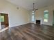 Spacious living room with a fireplace, wood floors, ceiling fan, and lots of natural light at 9454 Lakeview Ct, Douglasville, GA 30135