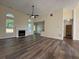 Spacious living room with fireplace, lots of light, and wood floors at 9454 Lakeview Ct, Douglasville, GA 30135