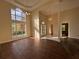 Open floor plan with high ceilings, grand windows, beautiful light fixtures, and wood floors at 9454 Lakeview Ct, Douglasville, GA 30135