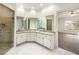 Bathroom with double sinks, walk-in shower, granite countertop and elegant mirrors at 105 Laurel Ridge Ct, Fayetteville, GA 30215