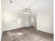 Bedroom with soft carpet, ceiling fan, and two doorways to adjoining spaces at 105 Laurel Ridge Ct, Fayetteville, GA 30215