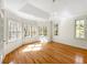 Spacious bedroom with hardwood floors, recessed lighting, and multiple windows at 105 Laurel Ridge Ct, Fayetteville, GA 30215