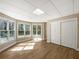 Sunlit bonus room with hardwood floors, large windows, and a closet for storage at 105 Laurel Ridge Ct, Fayetteville, GA 30215