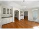 Elegant dining room with hardwood floors, archways and custom built-ins at 105 Laurel Ridge Ct, Fayetteville, GA 30215