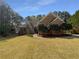 Charming brick home featuring manicured landscaping and a well-maintained lawn at 105 Laurel Ridge Ct, Fayetteville, GA 30215