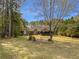 Charming brick home featuring a well-manicured lawn and mature trees offering curb appeal at 105 Laurel Ridge Ct, Fayetteville, GA 30215