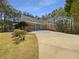 Spacious three-car garage with an expansive driveway offering ample parking and storage at 105 Laurel Ridge Ct, Fayetteville, GA 30215