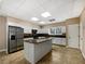 Functional kitchen with granite countertops, an island, and stainless steel appliances at 105 Laurel Ridge Ct, Fayetteville, GA 30215