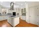 Modern kitchen featuring granite countertops, stainless steel appliances, and custom cabinetry at 105 Laurel Ridge Ct, Fayetteville, GA 30215