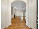 Open-concept living room with hardwood floors and an archway entryway at 105 Laurel Ridge Ct, Fayetteville, GA 30215