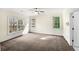 Empty primary bedroom featuring three windows at 105 Laurel Ridge Ct, Fayetteville, GA 30215