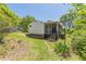 A spacious backyard, featuring a screened-in porch and lush green grass, perfect for outdoor relaxation and entertainment at 1325 East Forrest Ave, East Point, GA 30344
