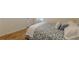 Bright bedroom with wood floors, light colored walls, and a patterned bedspread at 1325 East Forrest Ave, East Point, GA 30344