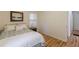 Sunny bedroom with wood floors, soft natural light, and access to another room at 1325 East Forrest Ave, East Point, GA 30344
