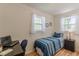 Bedroom with a desk area, wood floors, and two windows at 1325 East Forrest Ave, East Point, GA 30344