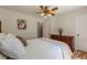 Comfortable bedroom featuring a dresser, wood floors, and a bright window at 1325 East Forrest Ave, East Point, GA 30344