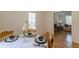 Elegant dining table set with a view into the living room, promoting an open concept at 1325 East Forrest Ave, East Point, GA 30344