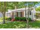 Well-kept lawn with attractive shade tree and covered parking at 1325 East Forrest Ave, East Point, GA 30344