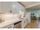 Bright kitchen with modern white cabinets, stainless appliances, and convenient dishwasher at 1325 East Forrest Ave, East Point, GA 30344