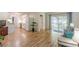 Open concept, with a view of the kitchen and sliding doors leading to a screened-in patio at 1325 East Forrest Ave, East Point, GA 30344