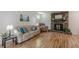 Inviting living room with hardwood floors, comfortable seating, and a charming brick fireplace at 1325 East Forrest Ave, East Point, GA 30344