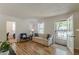 Cozy living room featuring laminate floors, fresh paint and natural light at 1325 East Forrest Ave, East Point, GA 30344