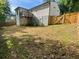 View of home's backyard featuring wooden privacy fence, lawn, and upper-level deck at 185 Glenrose Sw Cir, Atlanta, GA 30354