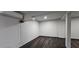 Basement with ductless air conditioner, modern laminate flooring, and neutral wall color at 185 Glenrose Sw Cir, Atlanta, GA 30354