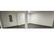 Finished basement area featuring laminate flooring and neutral paint, ready for customization at 185 Glenrose Sw Cir, Atlanta, GA 30354