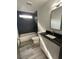 This bathroom boasts a modern vanity, tiled shower, and bath at 185 Glenrose Sw Cir, Atlanta, GA 30354
