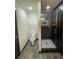 Modern bathroom featuring tile flooring, toilet, and black tiled glass enclosed shower at 185 Glenrose Sw Cir, Atlanta, GA 30354