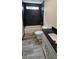 The renovated bathroom features a tiled shower, bath and modern vanity at 185 Glenrose Sw Cir, Atlanta, GA 30354