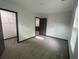 This bedroom has neutral walls, carpet flooring and an easy access to the closet at 185 Glenrose Sw Cir, Atlanta, GA 30354