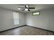 Comfortable bedroom with wood-look floors and two windows at 185 Glenrose Sw Cir, Atlanta, GA 30354