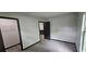This bedroom features plush carpeting, neutral walls and trim, and a walk-in closet for ample storage at 185 Glenrose Sw Cir, Atlanta, GA 30354