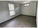 This bedroom boasts carpet flooring, neutral walls and a window for natural light at 185 Glenrose Sw Cir, Atlanta, GA 30354