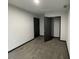 This bedroom offers neutral walls, carpet flooring, and a closet for storage at 185 Glenrose Sw Cir, Atlanta, GA 30354