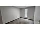 Empty bedroom with carpeted flooring and a window with blinds at 185 Glenrose Sw Cir, Atlanta, GA 30354